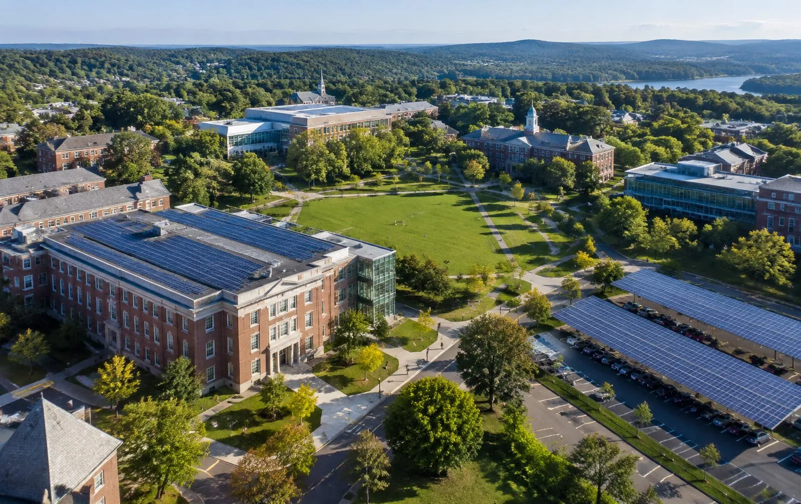 University campus with solar panels on an academic building and campus parking